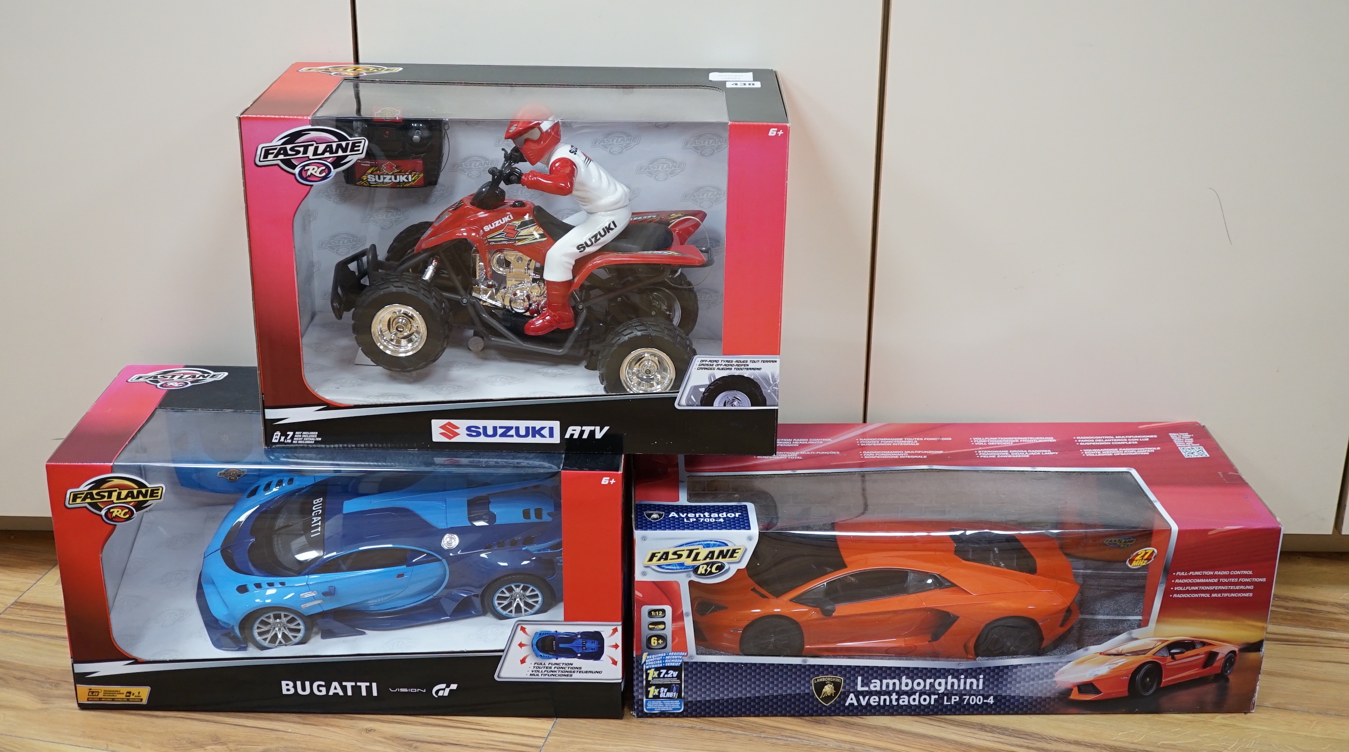 Three boxed FastLane RC cars